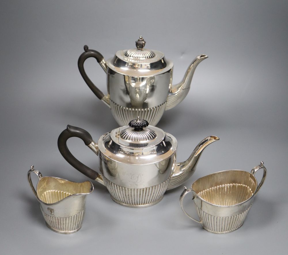 An Edwardian four piece demi-fluted oval silver tea and coffee set, Mappin & Webb, Sheffield, 1902, gross 38oz.